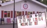 “Muslims Get out” sign outside a restaurant 